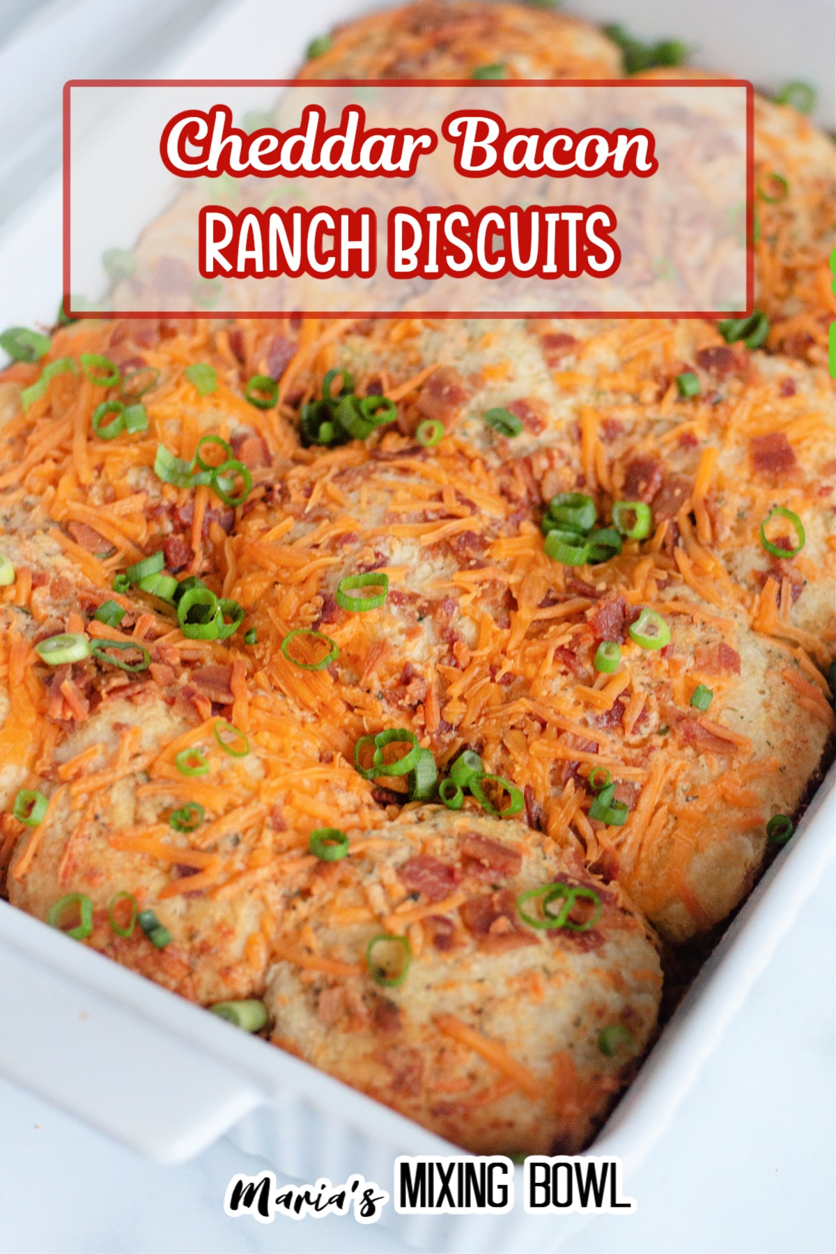 baked cheddar bacon ranch biscuits in a white casserole dish