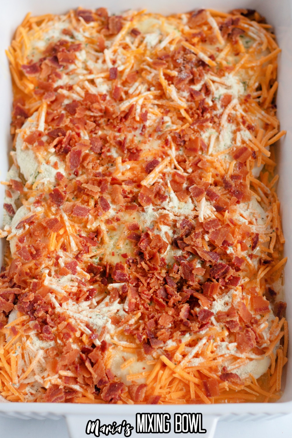 cheddar cheese and bacon on top of frozen biscuits