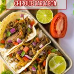 copycat chipotle barbacoa tacos on a metal baking tray with a lime half