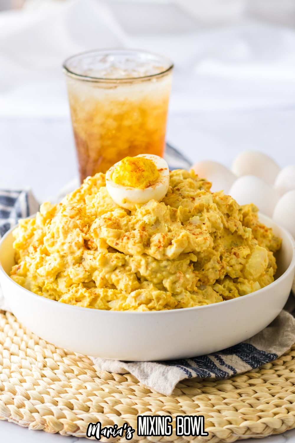 white bowl filled with deviled egg potato salad