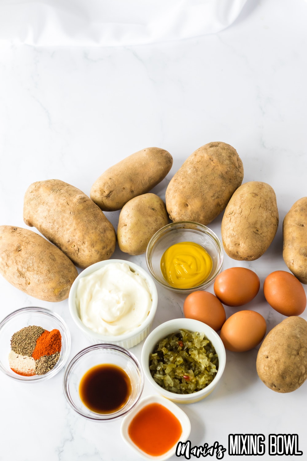 potatoes, mayo, mustard, eggs, seasonings, relish, hot sauce, Worcestershire sauce
