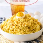 white bowl filled with deviled egg potato salad