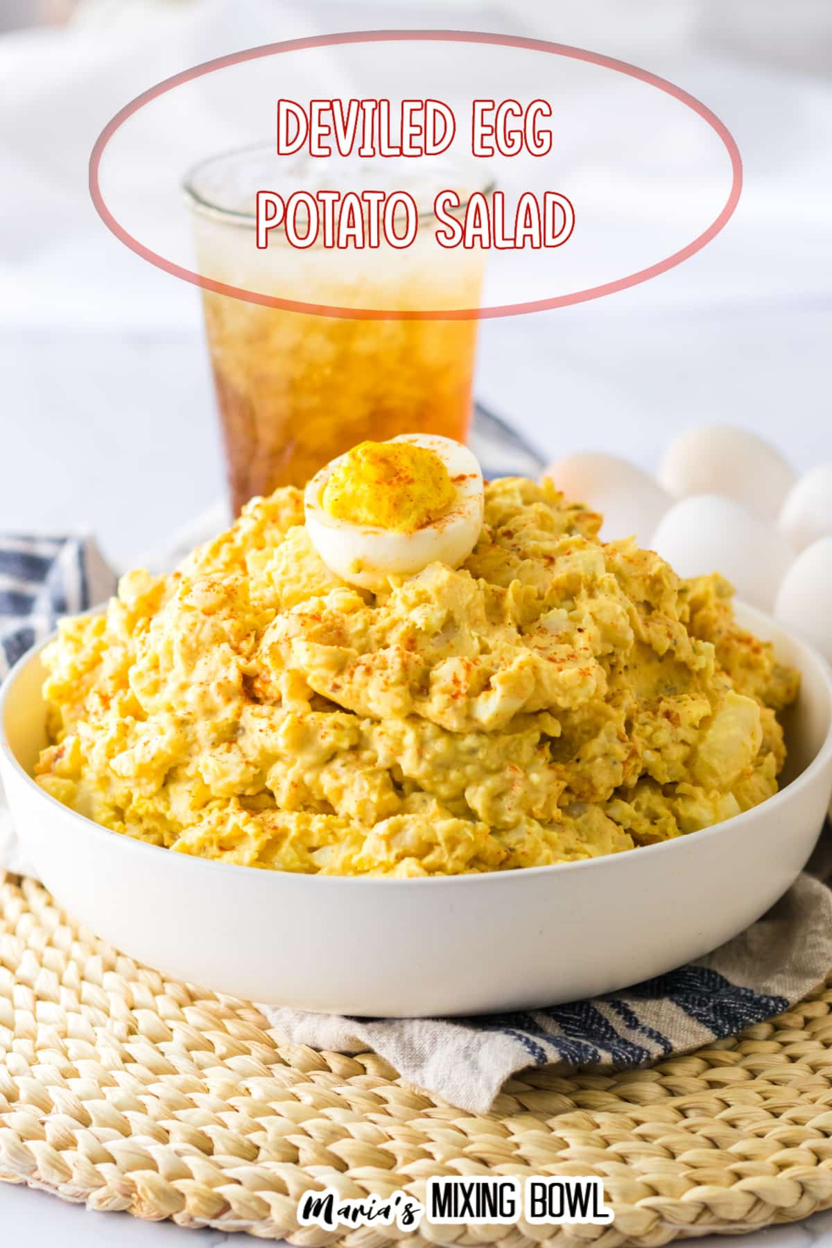white bowl filled with deviled egg potato salad