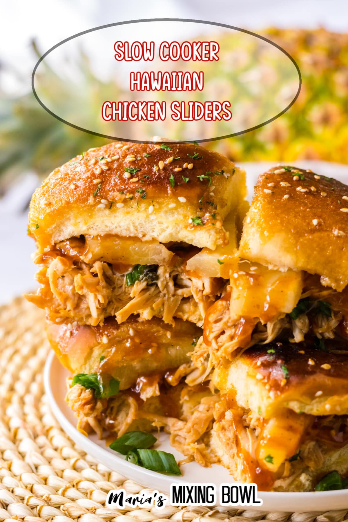 hawaiian chicken sliders stacked on top of each other on a white plate