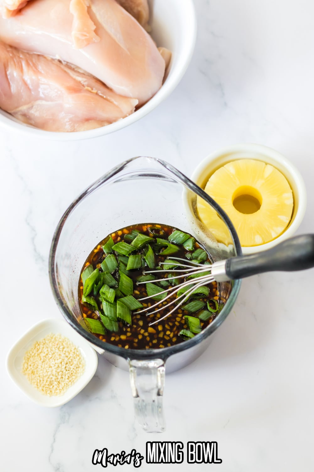 hawaiian bbq sauce being whisked in a glass measuring cup