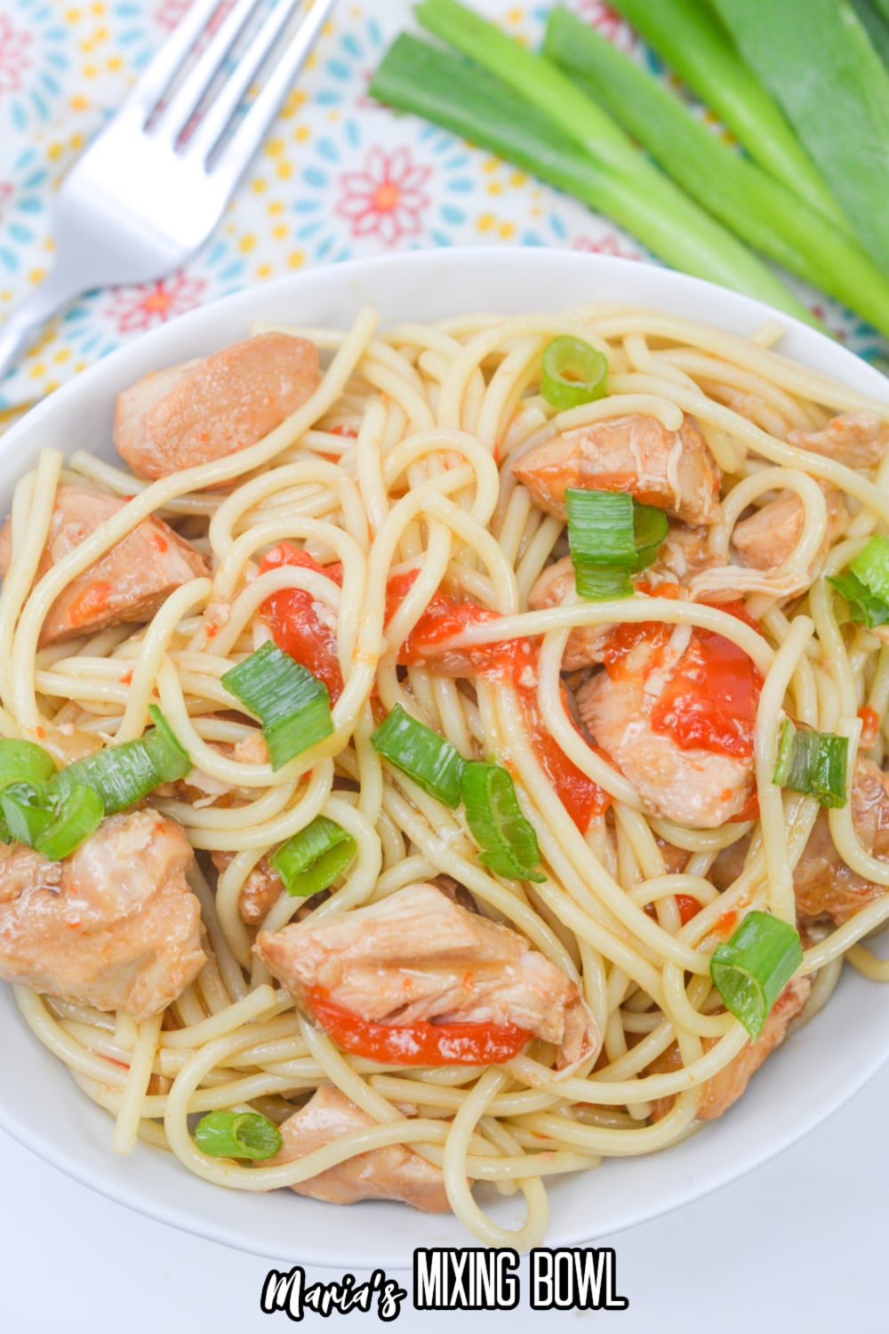 white bowl filled with honey garlic chicken and noodles