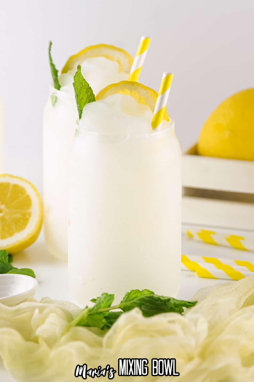 two lemonade slushies on a white background