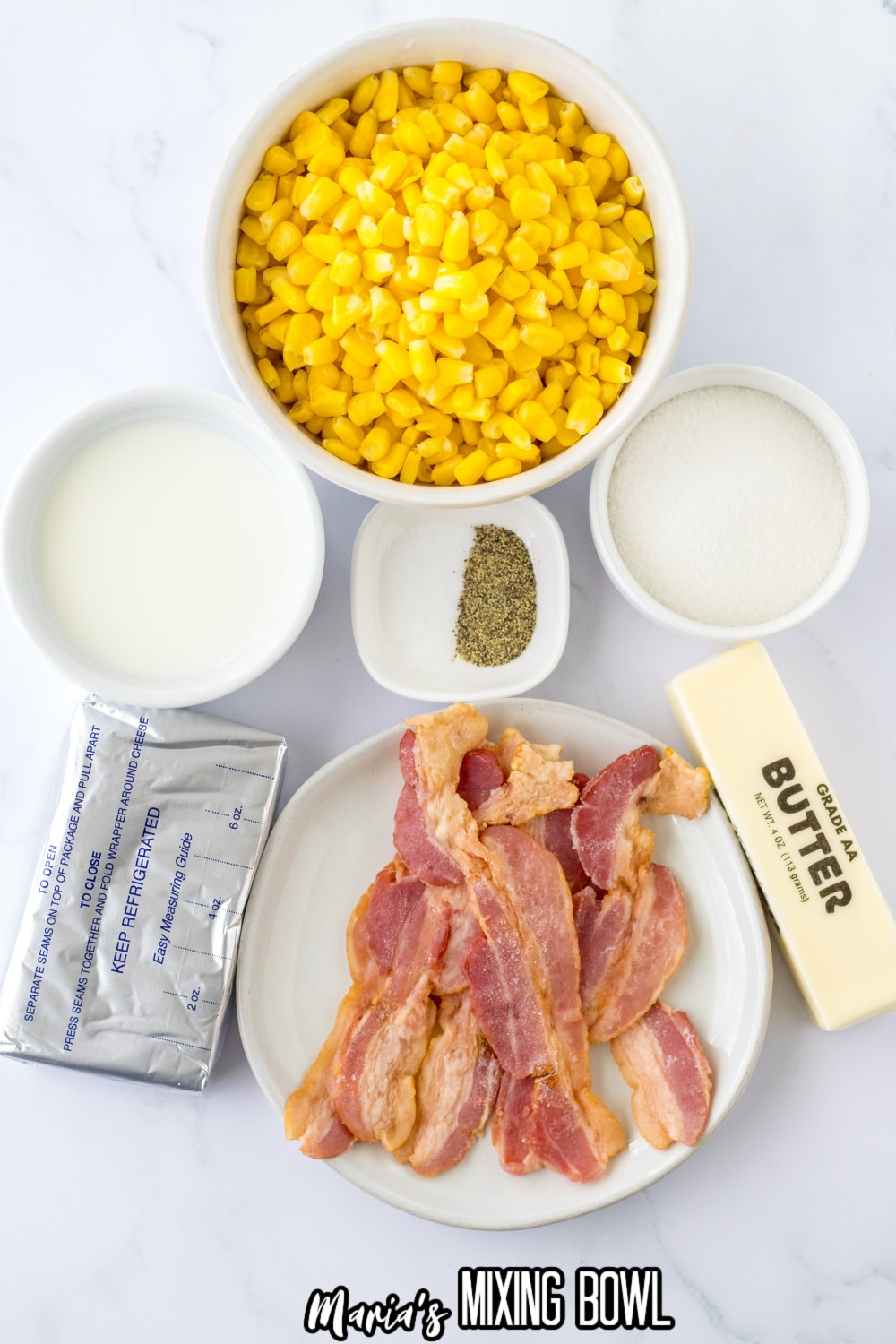 frozen corn, cream cheese, butter, bacon, salt, and pepper on a white background