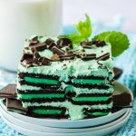 slice of mint chocolate icebox cake on a stack of small white plates