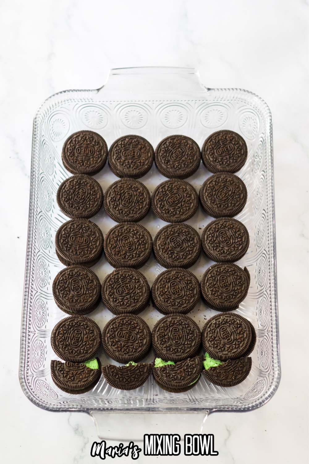 oreo cookies on the bottom of a glass baking dish