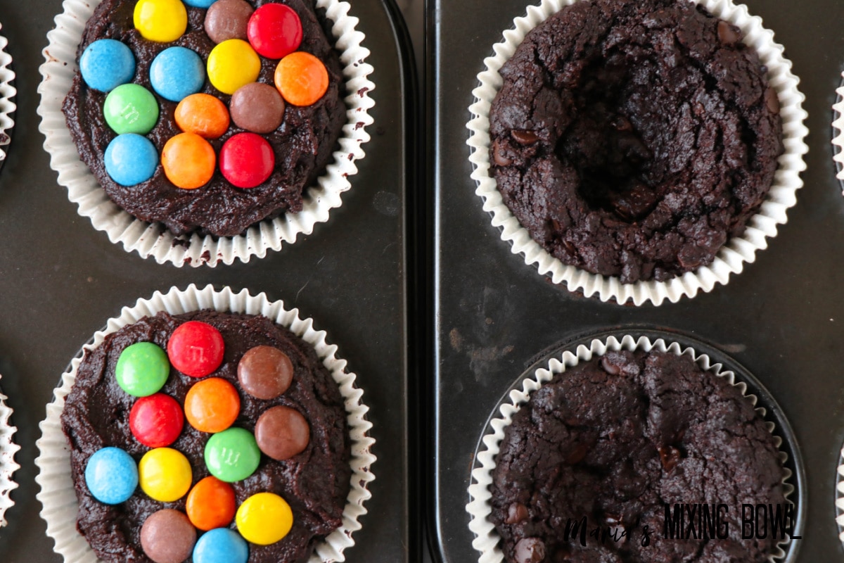 m&m's being pressed on top of brownies in a baking dish