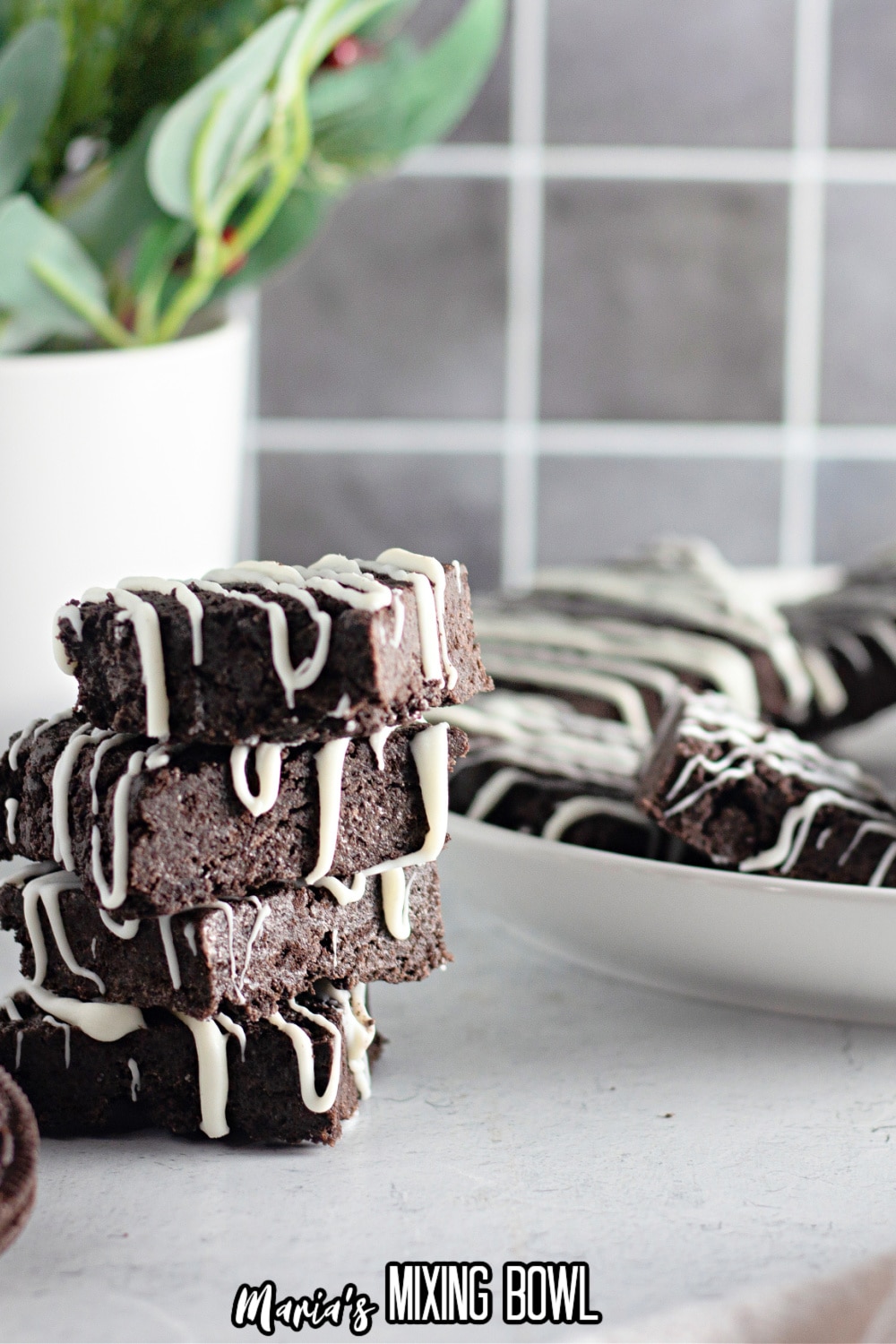 four oreo bars stacked on top of each other on a white backdrop