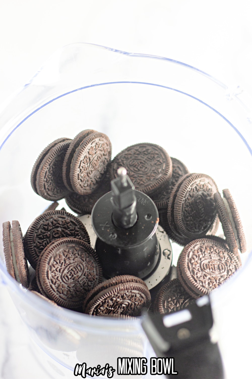 oreo cookies in a food processor about to be crushed