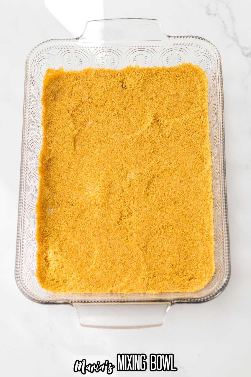 graham cracker crust pressed into a glass baking dish