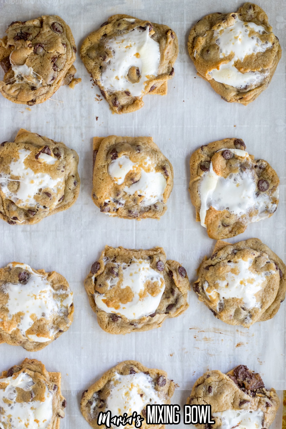baked smores cookies on a parchment lined baking sheet