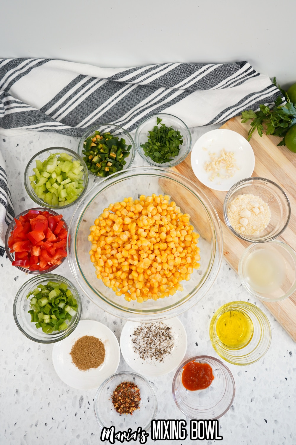 corn, green onions, tomatoes, celery, jalapeno, oil, garlic, and seasonings in a small bowl