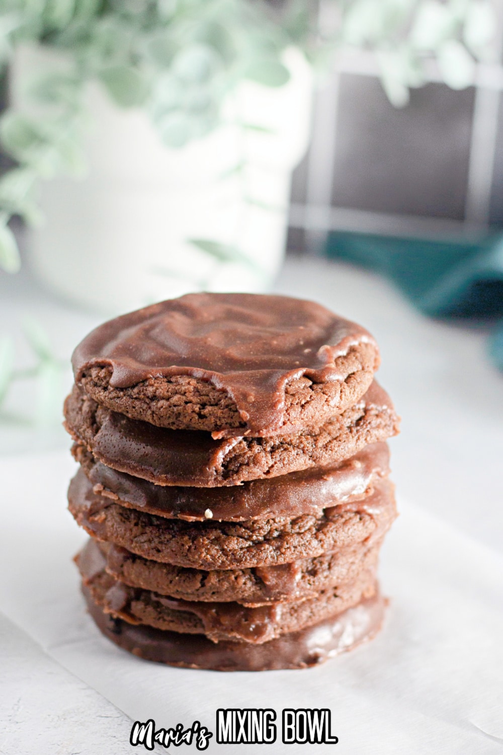 seven texas sheet cookies stacked on top of each other on a parchment paper
