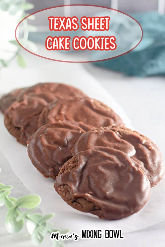 7 texas sheet cake cookies on a piece of parchment paper on a white background