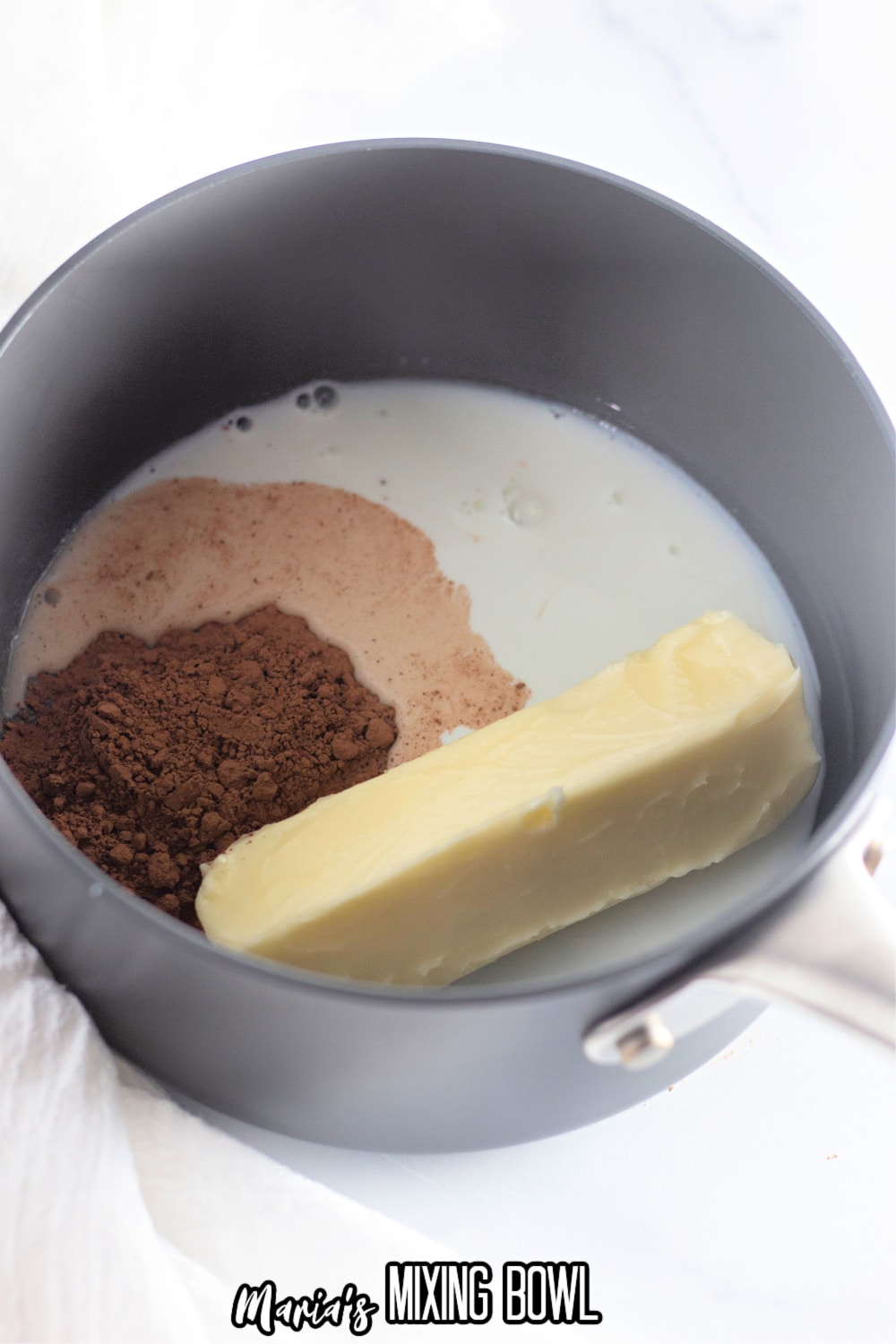 butter, cocoa powder, and milk in a saucepan