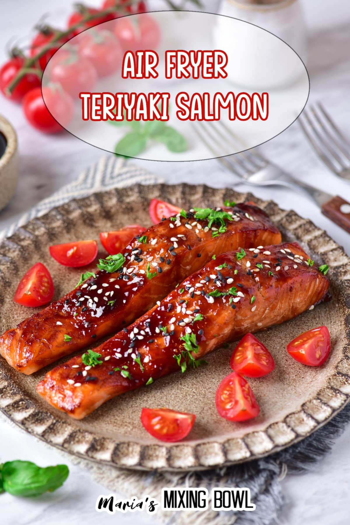 two salmon filets on a plate topped with sesame seeds and fresh parsley.