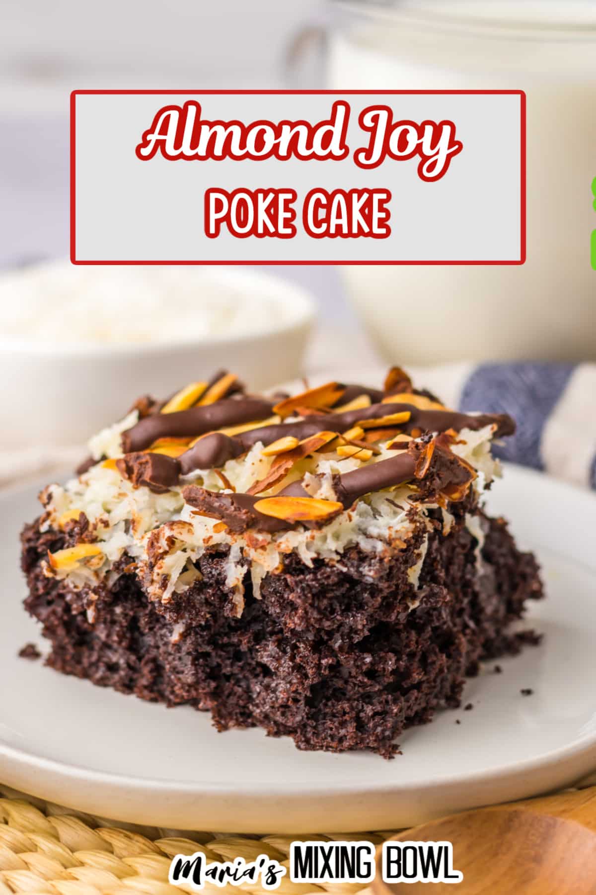 slice of almond joy poke cake on a white plate