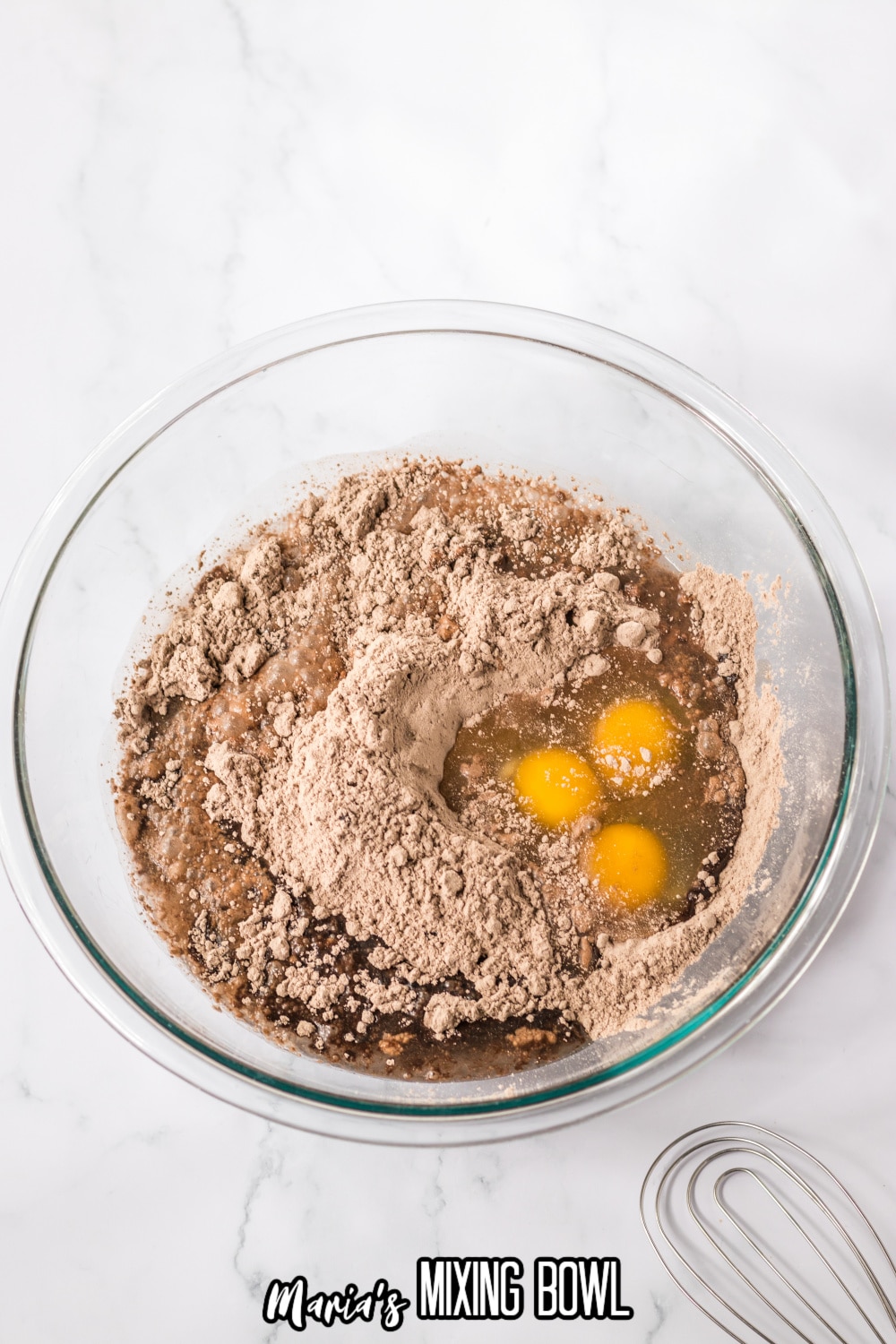 cake mix, eggs, and oil in a glass mixing bowl