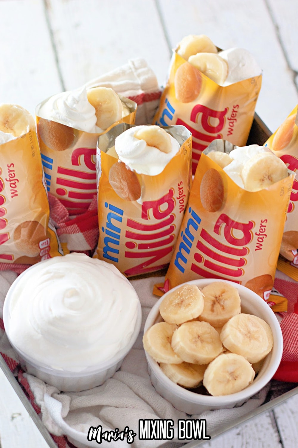 mini nilla wafer bags filled with banana pudding on a square baking dish