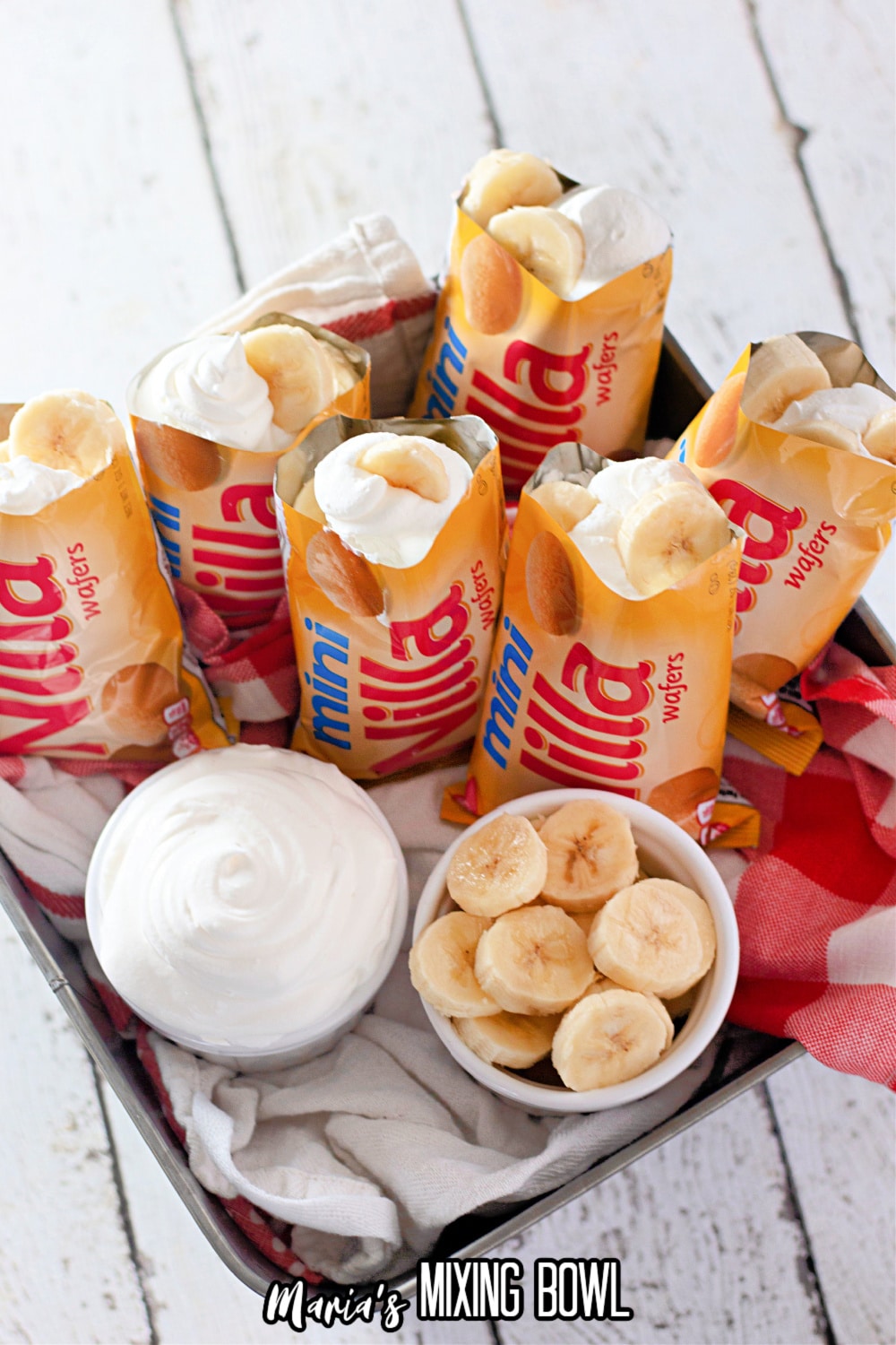 mini nilla wafer bags filled with banana pudding on a square baking dish
