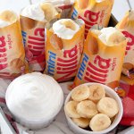 mini nilla wafer bags filled with banana pudding on a square baking dish