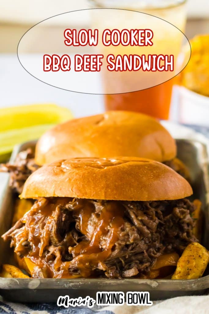 shredded bbq beef sandwich on a metal serving tray.