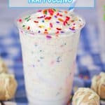 birthday cake Frappuccino on a blue and white checkered towel with a blue and white striped straw