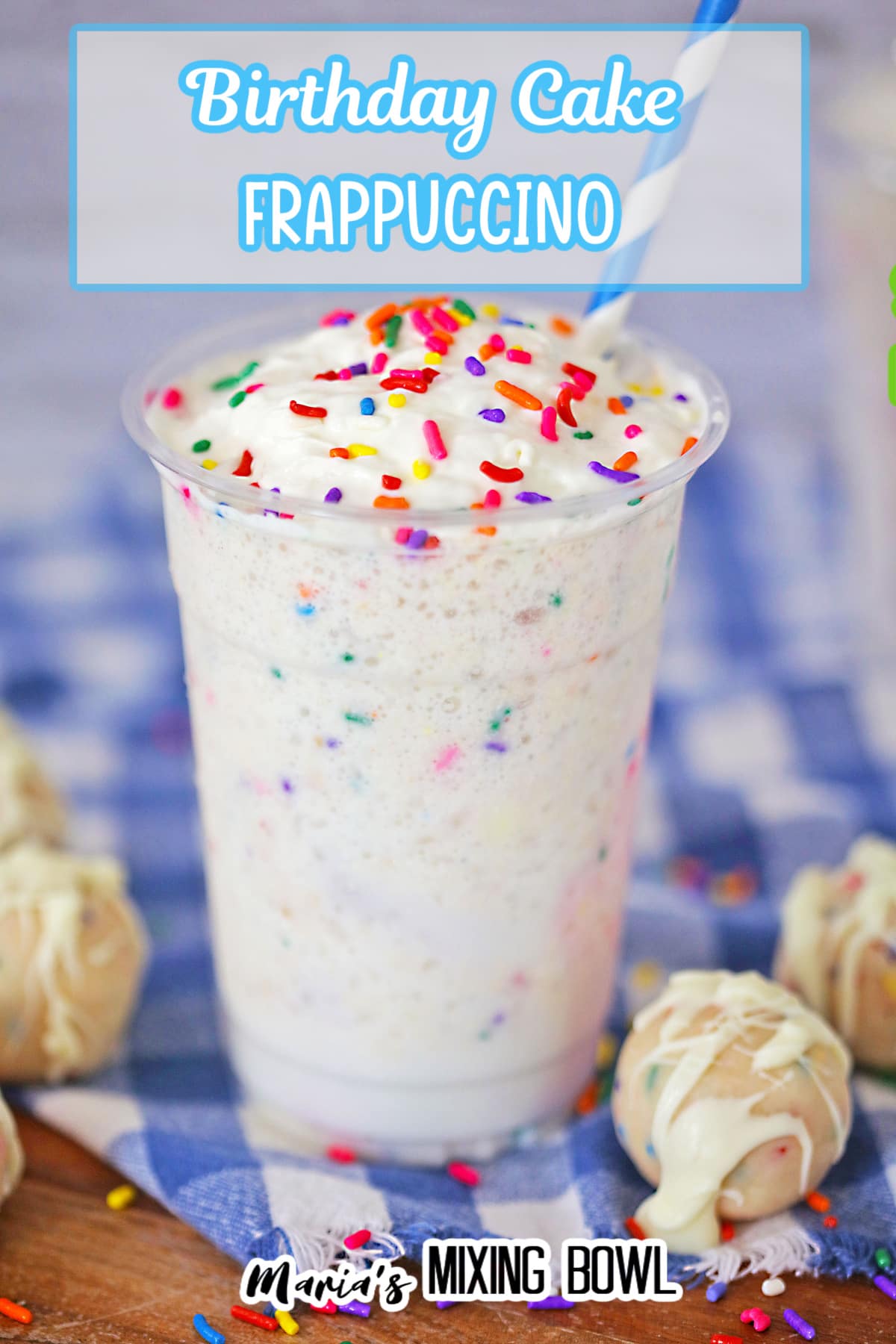 birthday cake Frappuccino on a blue and white checkered towel with a blue and white striped straw