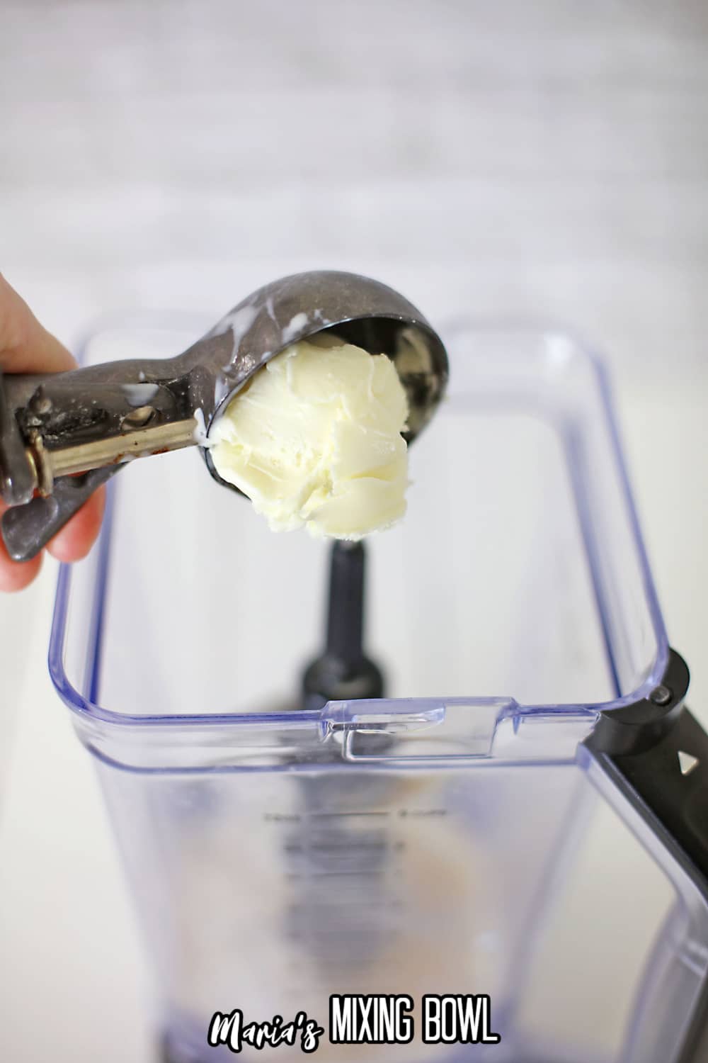 vanilla ice cream being added to a blender