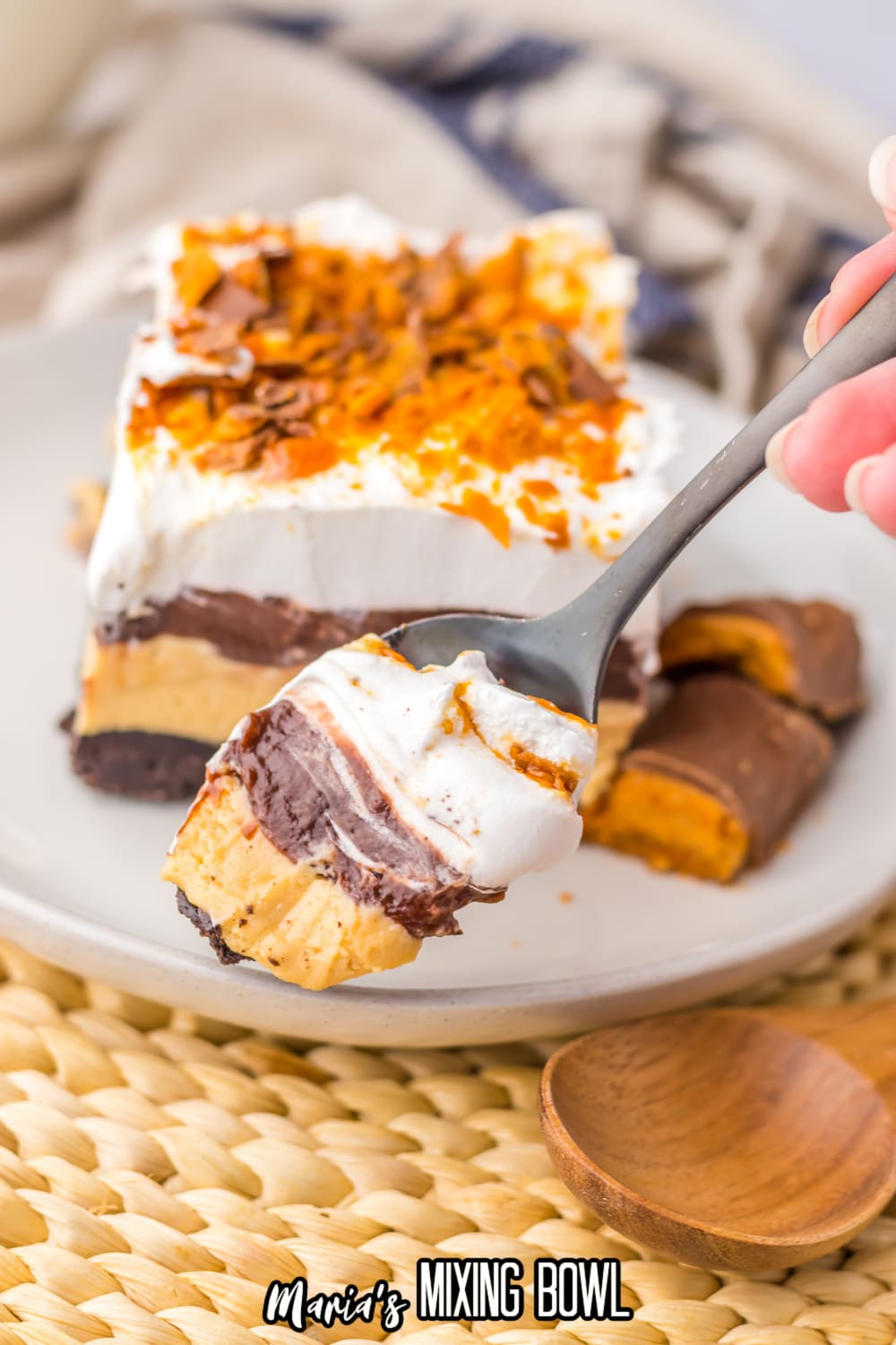 bite of butterfinger lush on a spoon held in the air