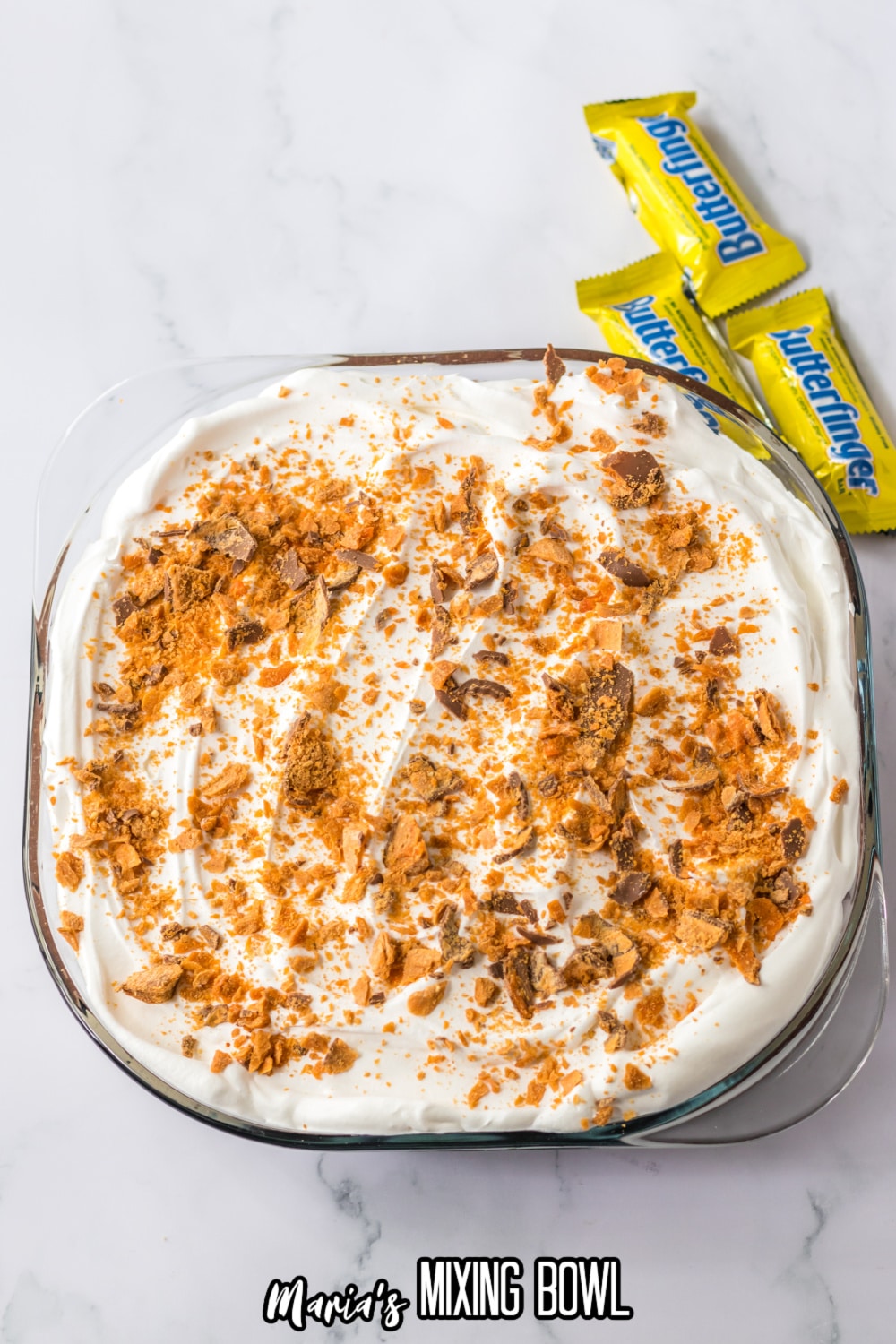 finished butterfinger lush in a glass casserole dish