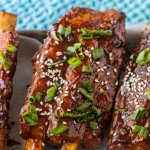 chinese spare ribs on a white rectangular plate