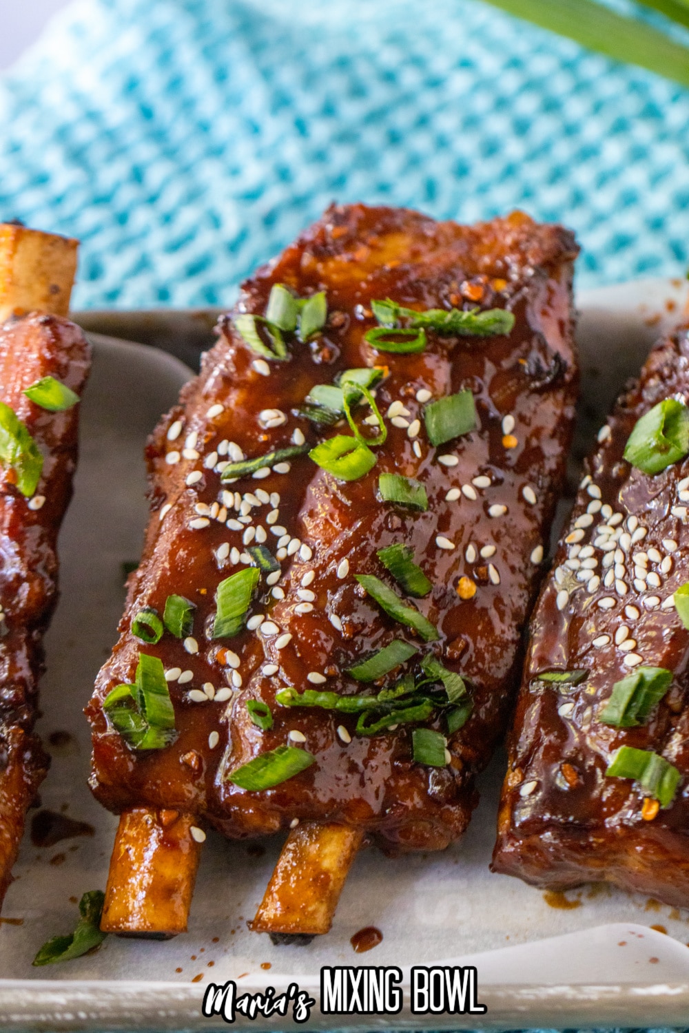 chinese spare ribs on a white rectangular plate