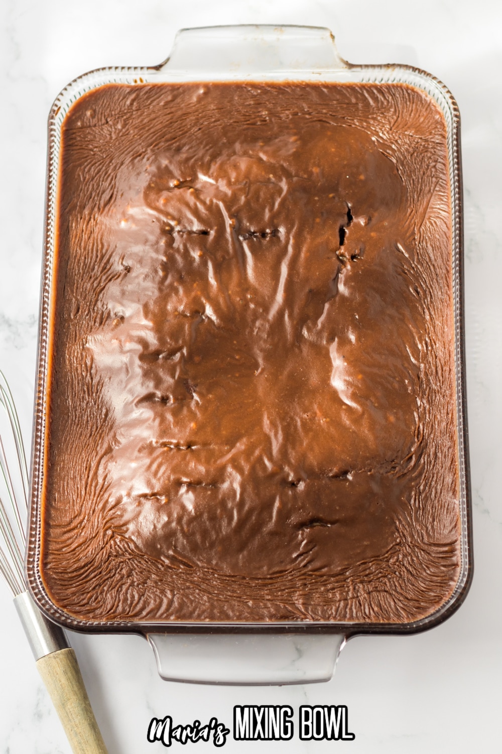 frosted coca cola cake in a glass baking dish