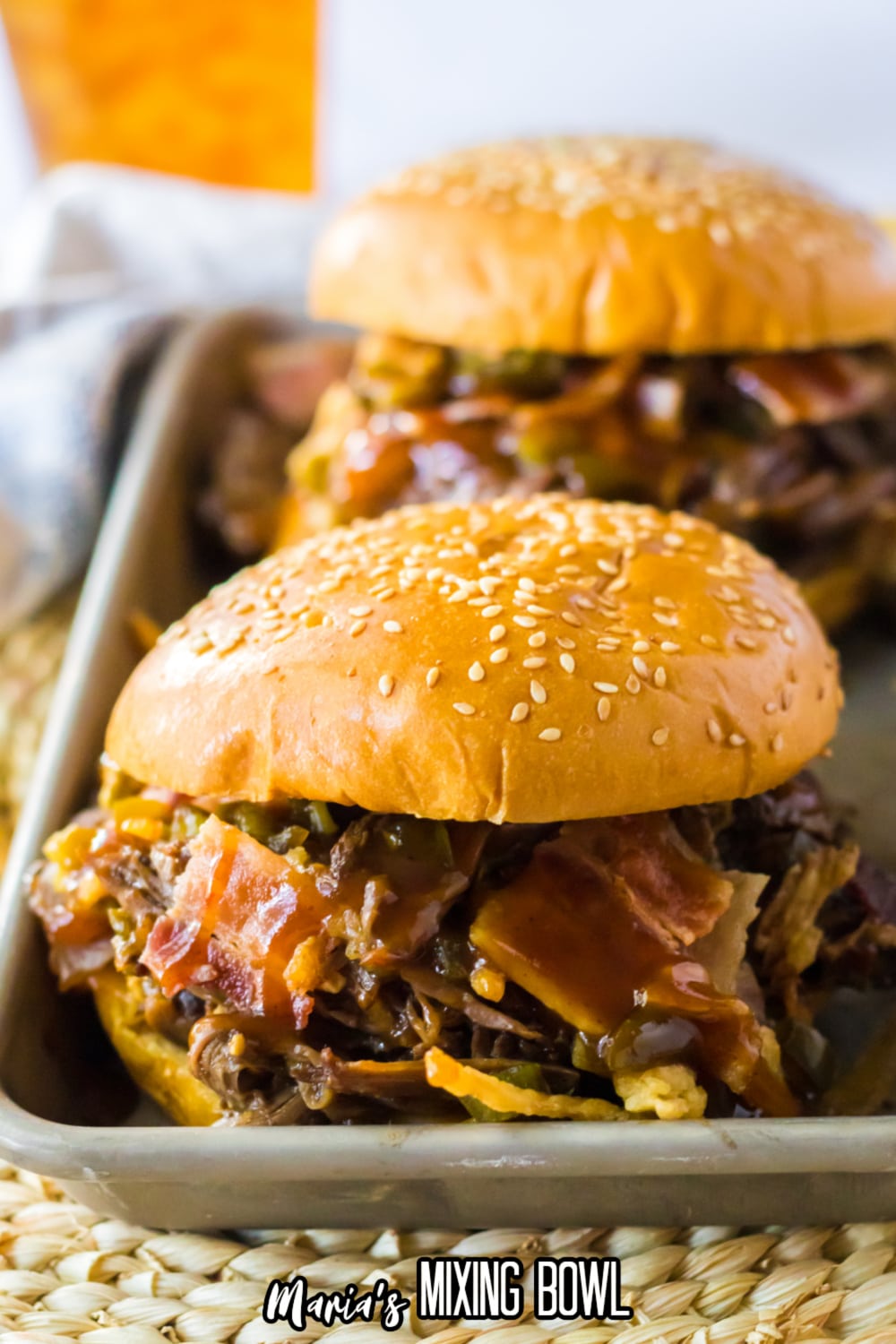 two slow cooker cowboy sandwiches on a metal tray