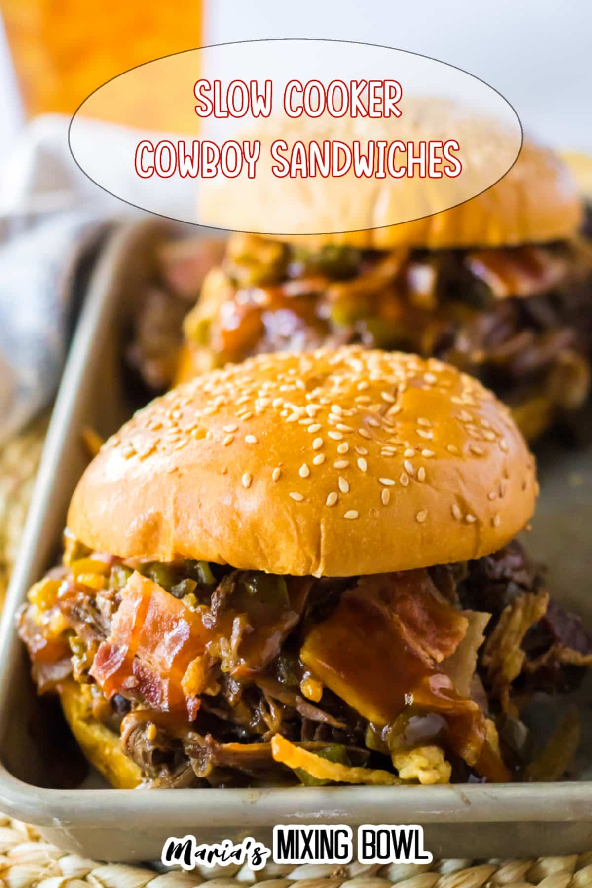 two slow cooker cowboy sandwiches on a metal tray