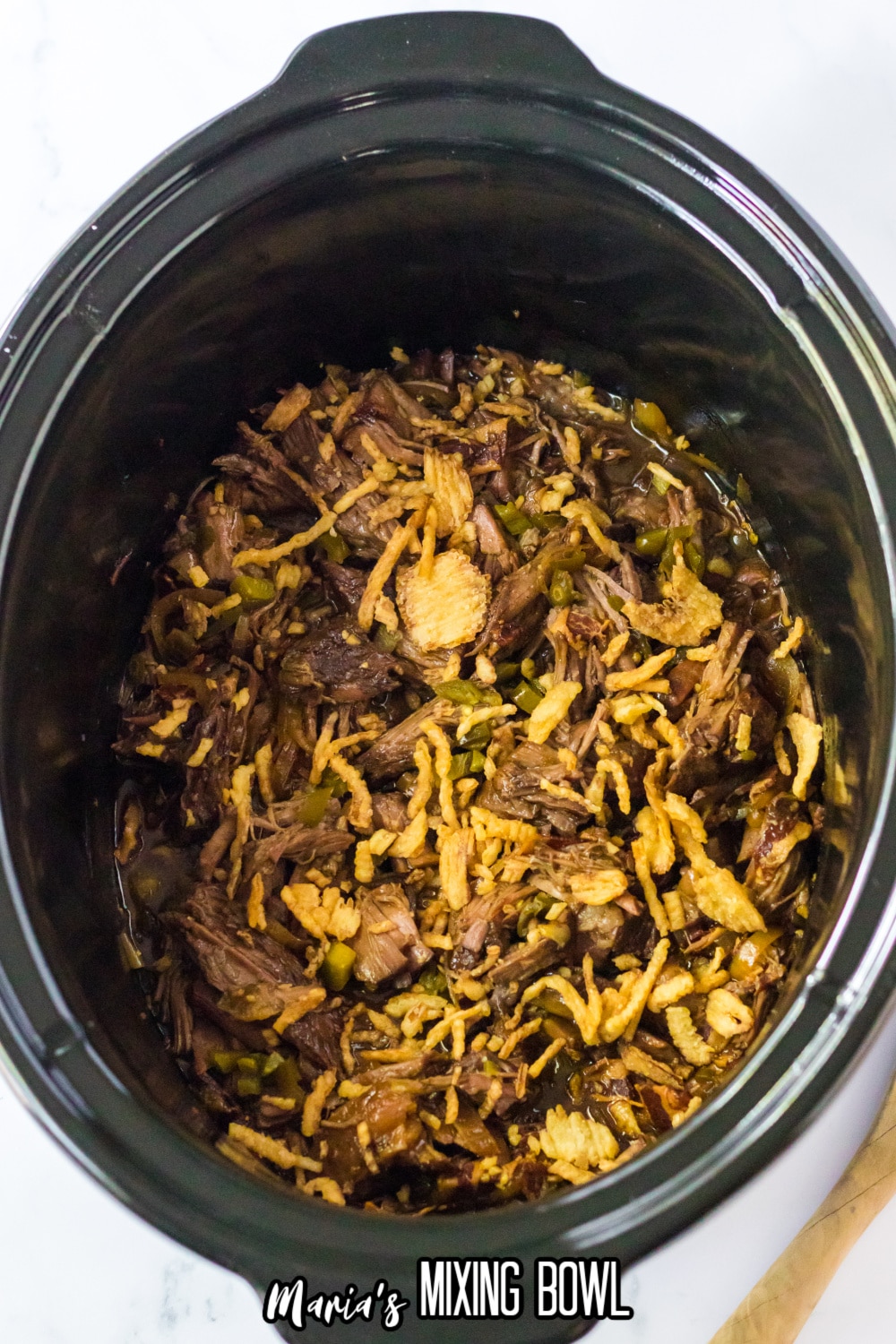 cooked roast for cowboy sandwiches in a slow cooker