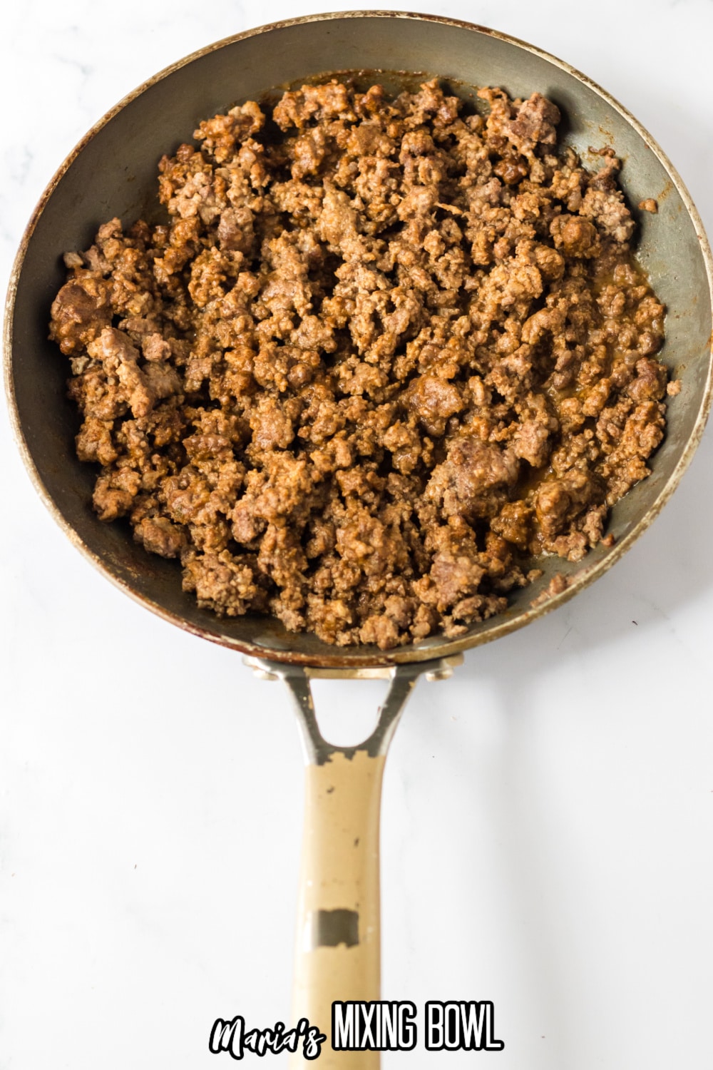 cooked ground beef in a large skillet seasoned with taco seasoning.
