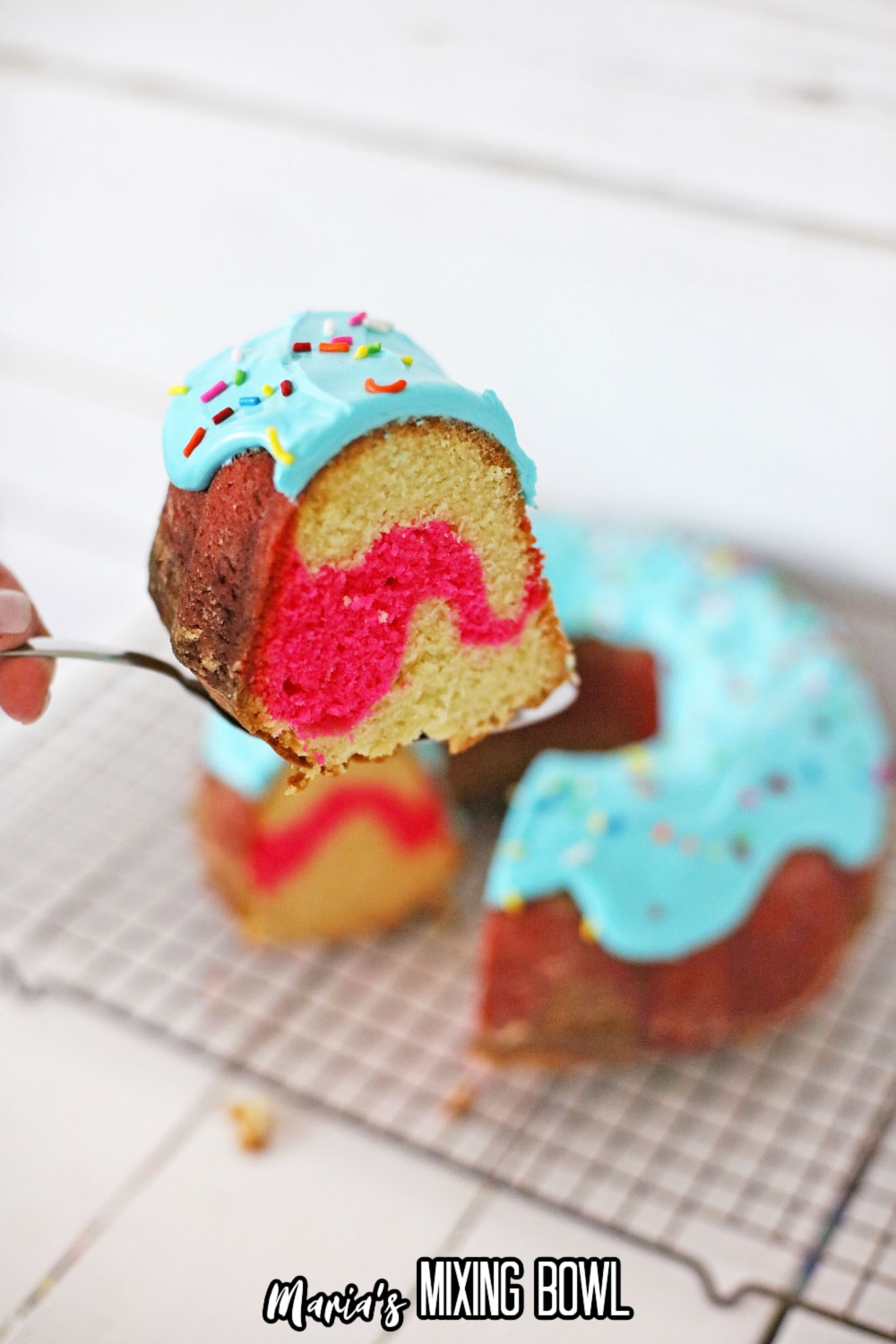 slice of donut cake on a spatula held in the air