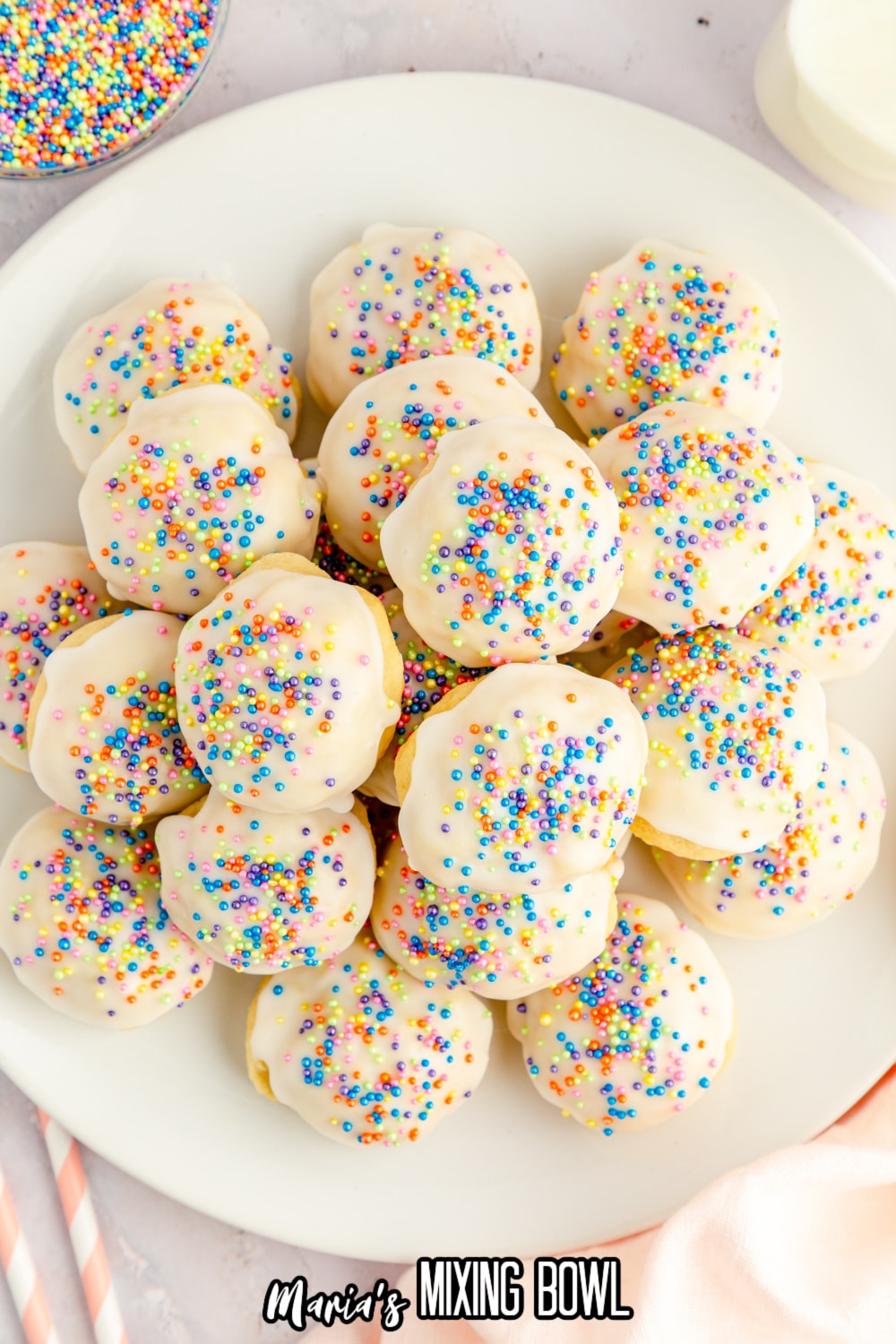 italian ricotta cookies stacked in a pyramid on a plate