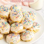 stack of italian ricotta cookies topped with pastel sprinkles on a white plate