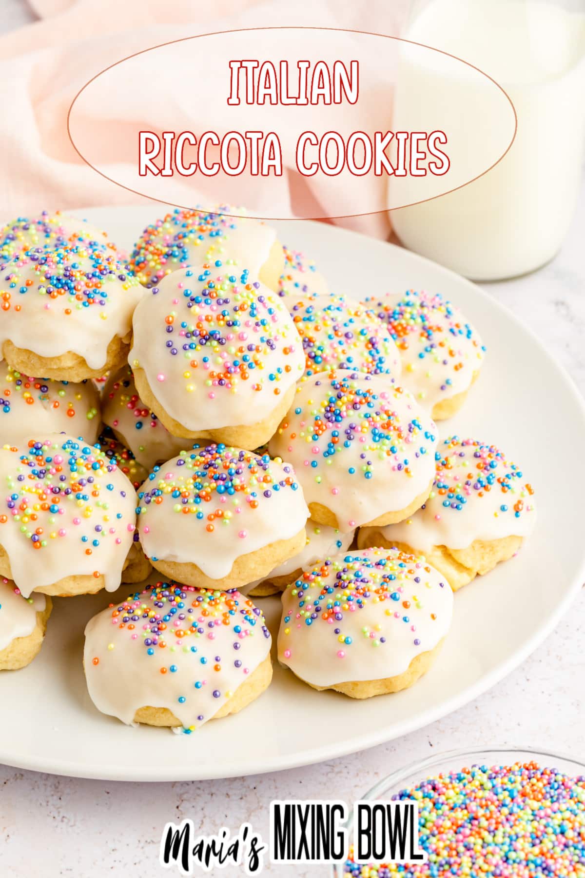 stack of italian ricotta cookies topped with pastel sprinkles on a white plate