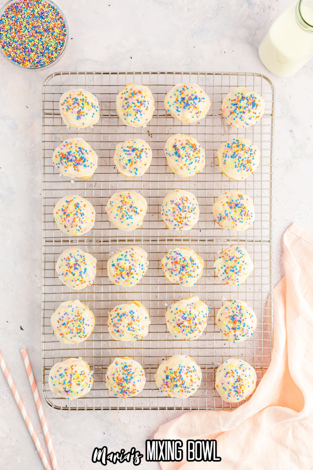 italian ricotta cookies cooking on a wire cooling rack