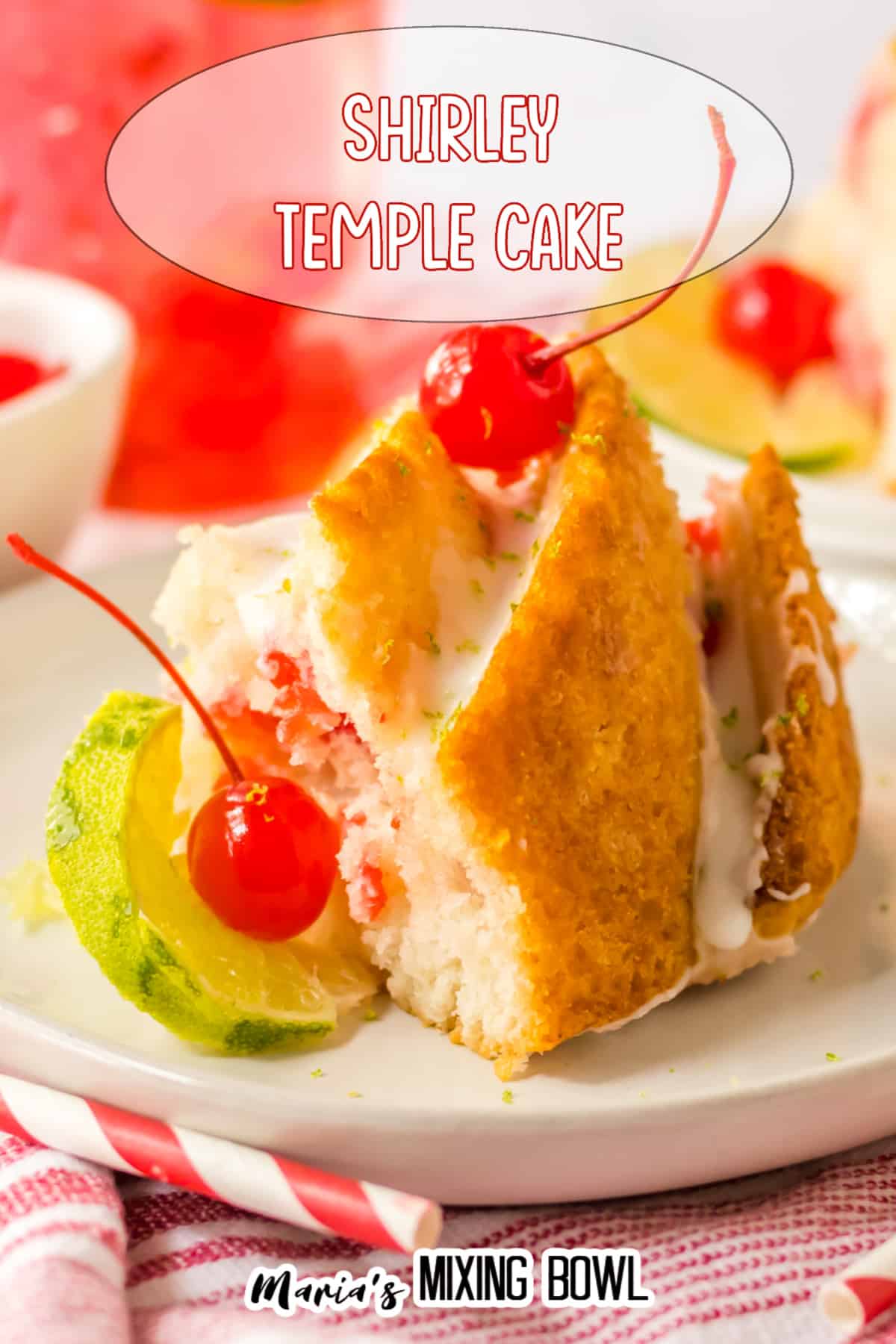 slice of Shirley temple cake topped with glaze and cherries on a white and gold plate