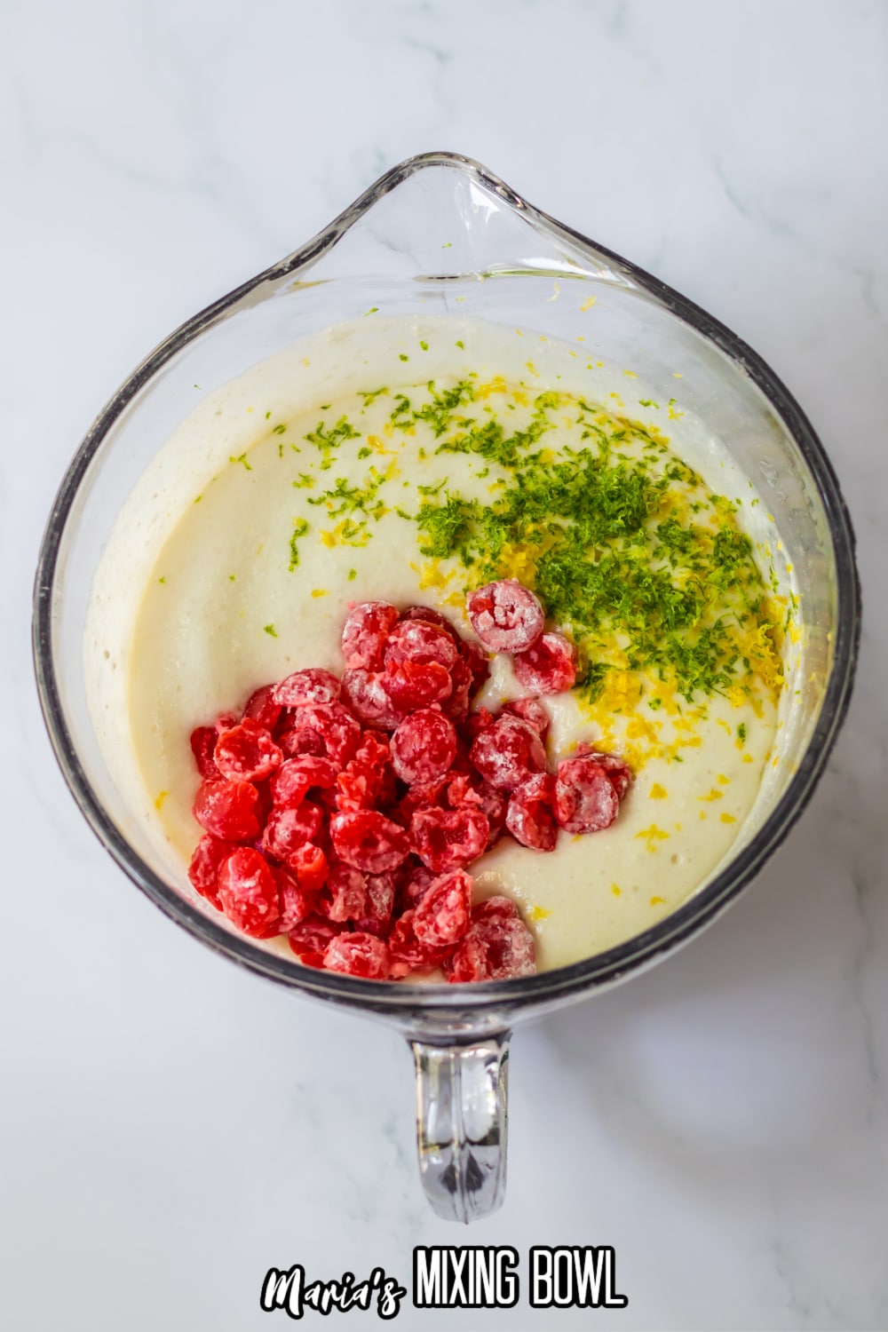 cake mix, lemon lime soda, lime zest, lemon zest, and cherries in a large mixing bowl