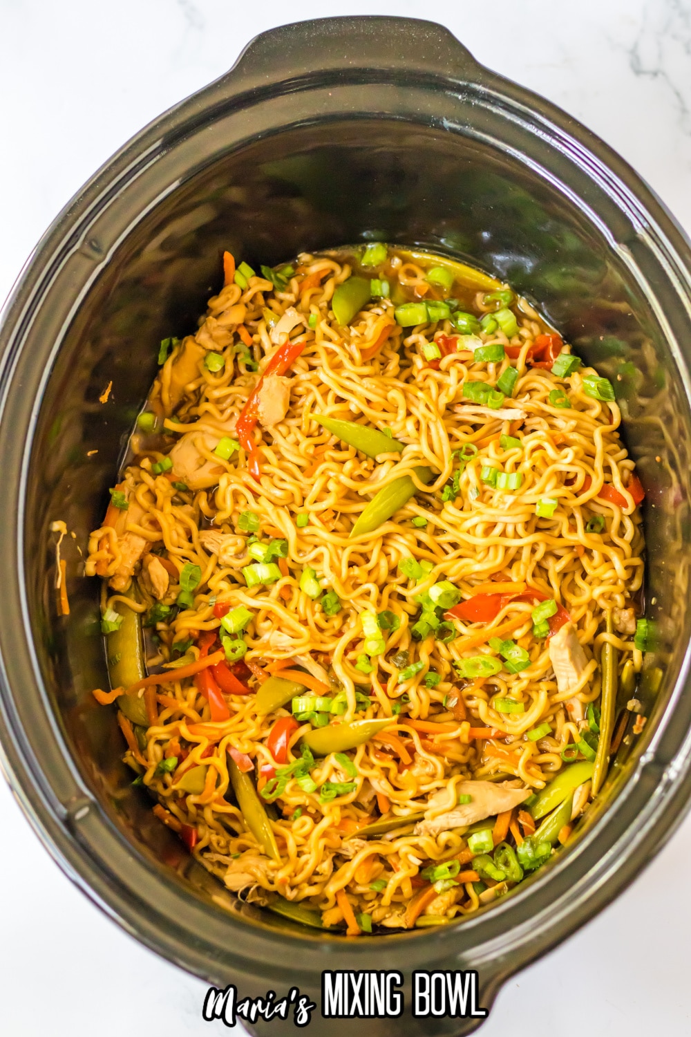 birds eye image of a bowl of chicken ramen in a slow cooker
